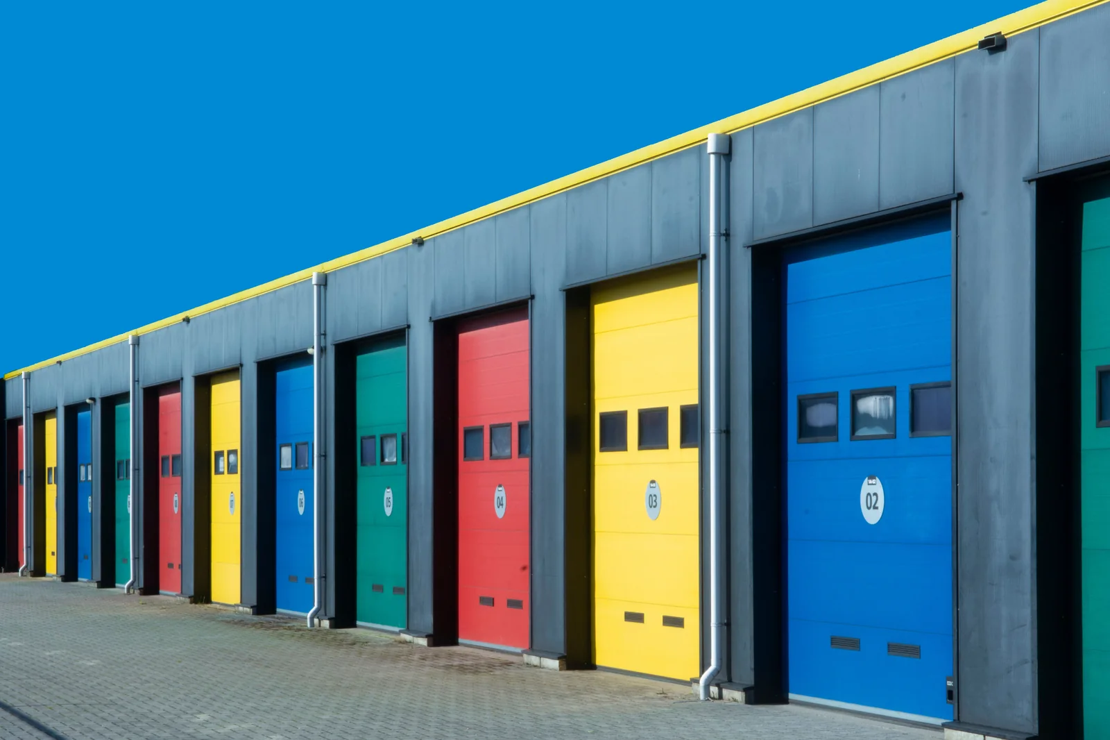 Commercial building with multiple overhead garage doors